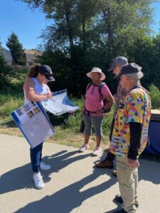 Canal trail users learn about upcoming improvements at a tabling event in Aurora.